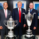 PGA CEO Pete Bevacqua, Donald Trump, and PGA of America President Ted Bishop with some giant trophies. (Photo: Mike Stobe/Getty Images)